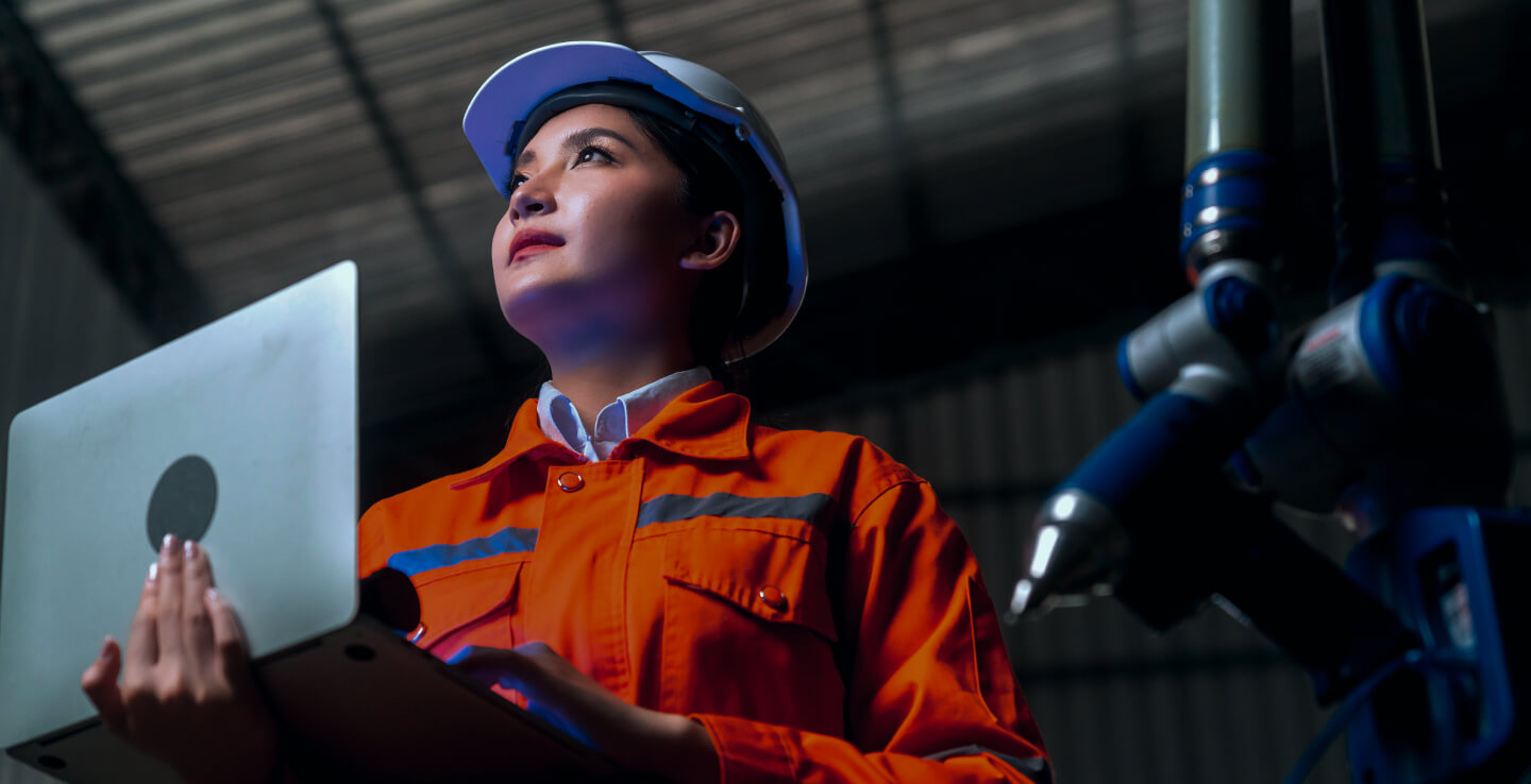 A female engineer looking up with determination
